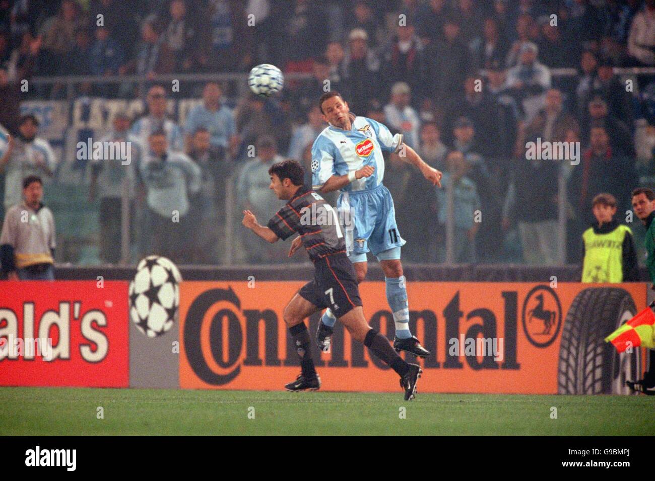 Soccer - UEFA Champions League - Quarter Final Second Leg - Lazio v Valencia. Lazio's Sinisa Mihajlovic (r) beats Valencia's Claudio Lopez (l) to a header Stock Photo