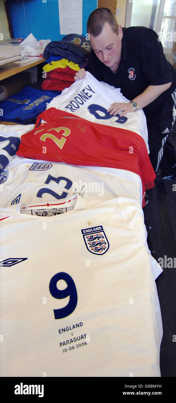 A worker checks the England team's World Cup kit, the first batch of which was being collected today by the FA from International Sports Services in Sowerby Bridge, near Halifax, West Yorkshire, in preparation for the first stages of the World Cup finals. Stock Photo