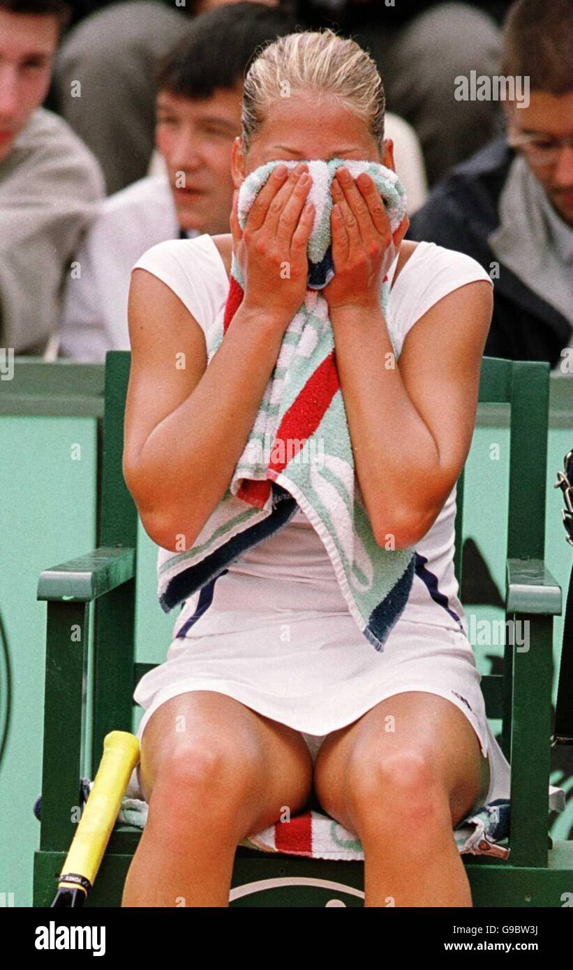 Tennis - French Open Roland Garros 2000. Anna Kournikova hides her face after her defeat by Silvia Plischke Stock Photo