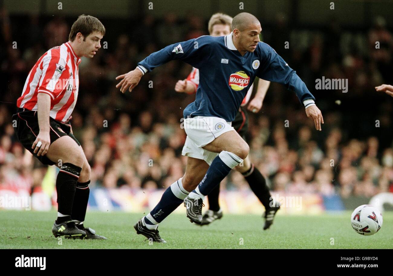 Leicester City's Stan Collymore (r) gets away from Sunderland's Paul Butler (l) Stock Photo