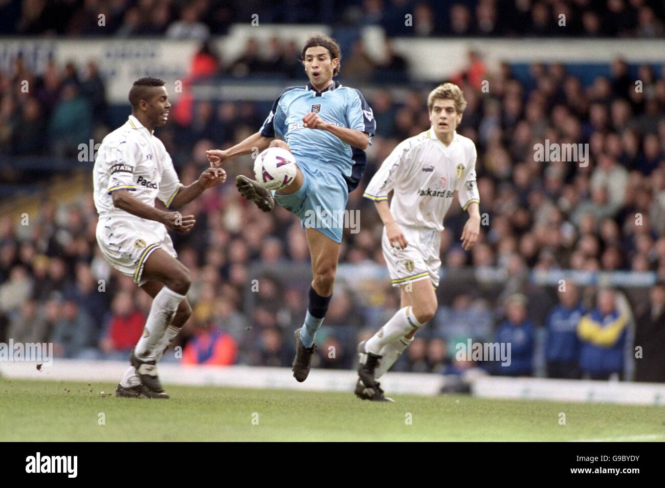 (L-R) Leeds United's Lucas Radebe watches as Coventry City's Youssef ...
