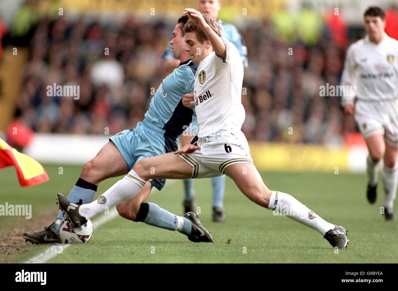 Soccer - FA Carling Premiership - Leeds United v Coventry City. Leeds  United's Jonathan Woodgate (r) tackles Coventry City's Cedric Roussel (l  Stock Photo - Alamy