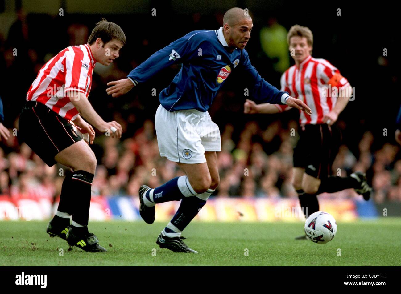 Soccer - FA Carling Premiership - Leicester City v Sunderland. Leicester City's Stan Collymore (r) holds off Sunderland's Paul Butler (l) Stock Photo