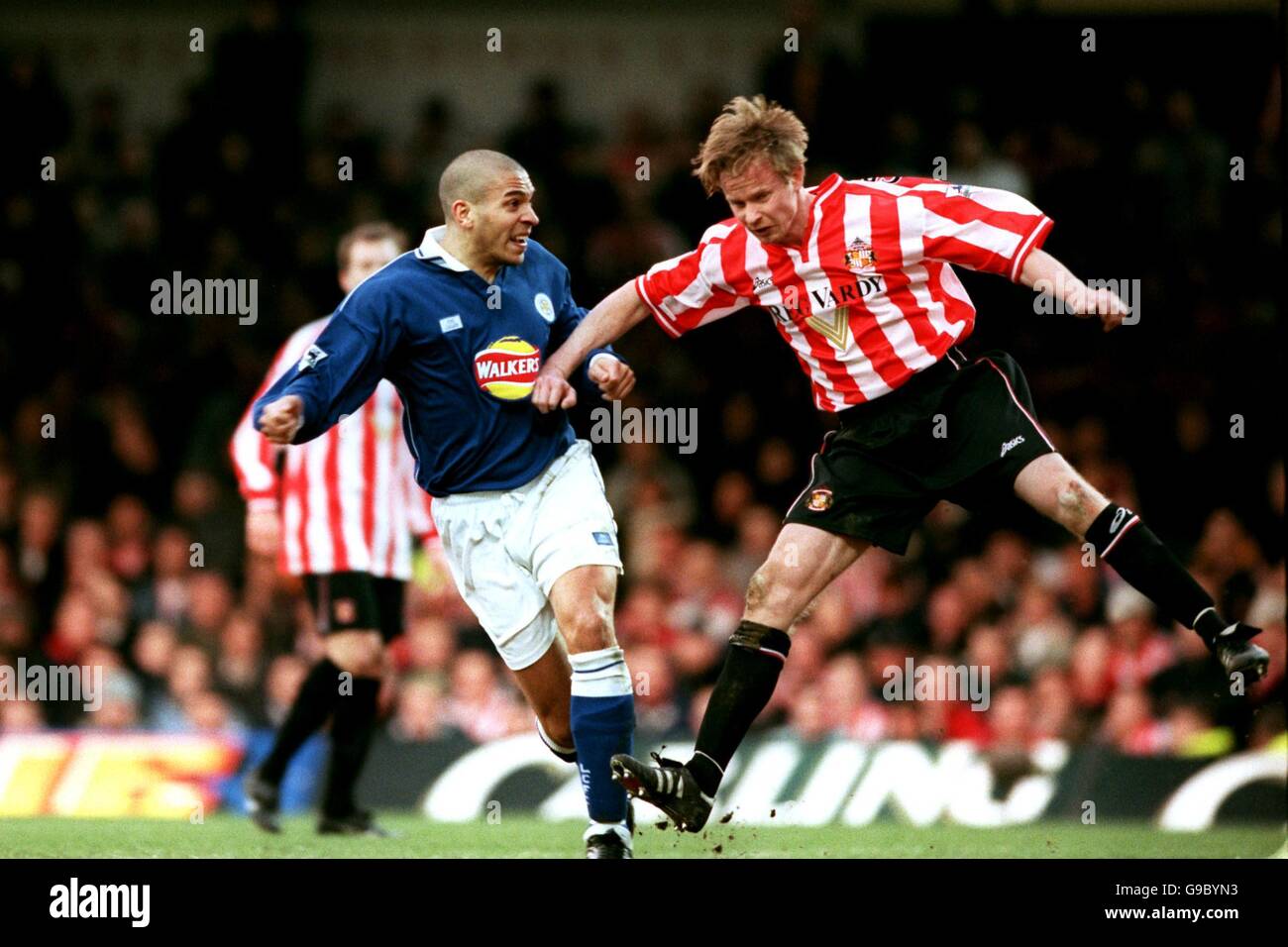 Leicester City's Stan Collymore (l) beats Sunderland's Jody Craddock (r) to head his second goal Stock Photo