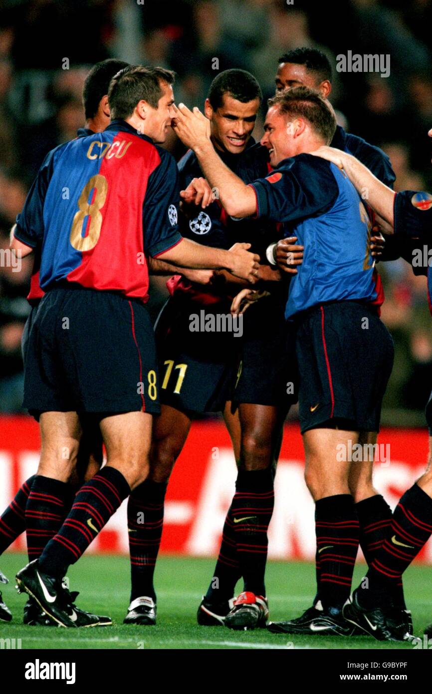 Barcelona's Frank De Boer (r) celebrates scoring his team's second goal with Philip Cocu (l), Rivaldo (c) and Patrick Kluivert (r, hidden) Stock Photo