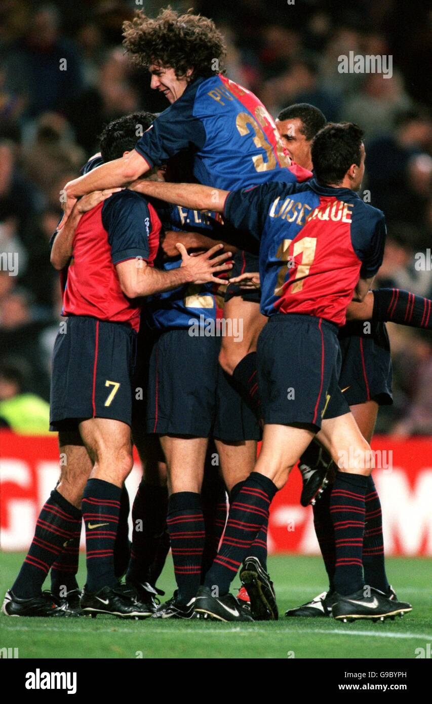 Soccer - UEFA Champions League - Group A - Barcelona v Porto. Barcelona's Frank De Boer (c) is mobbed by his teammates after putting his team into the lead Stock Photo