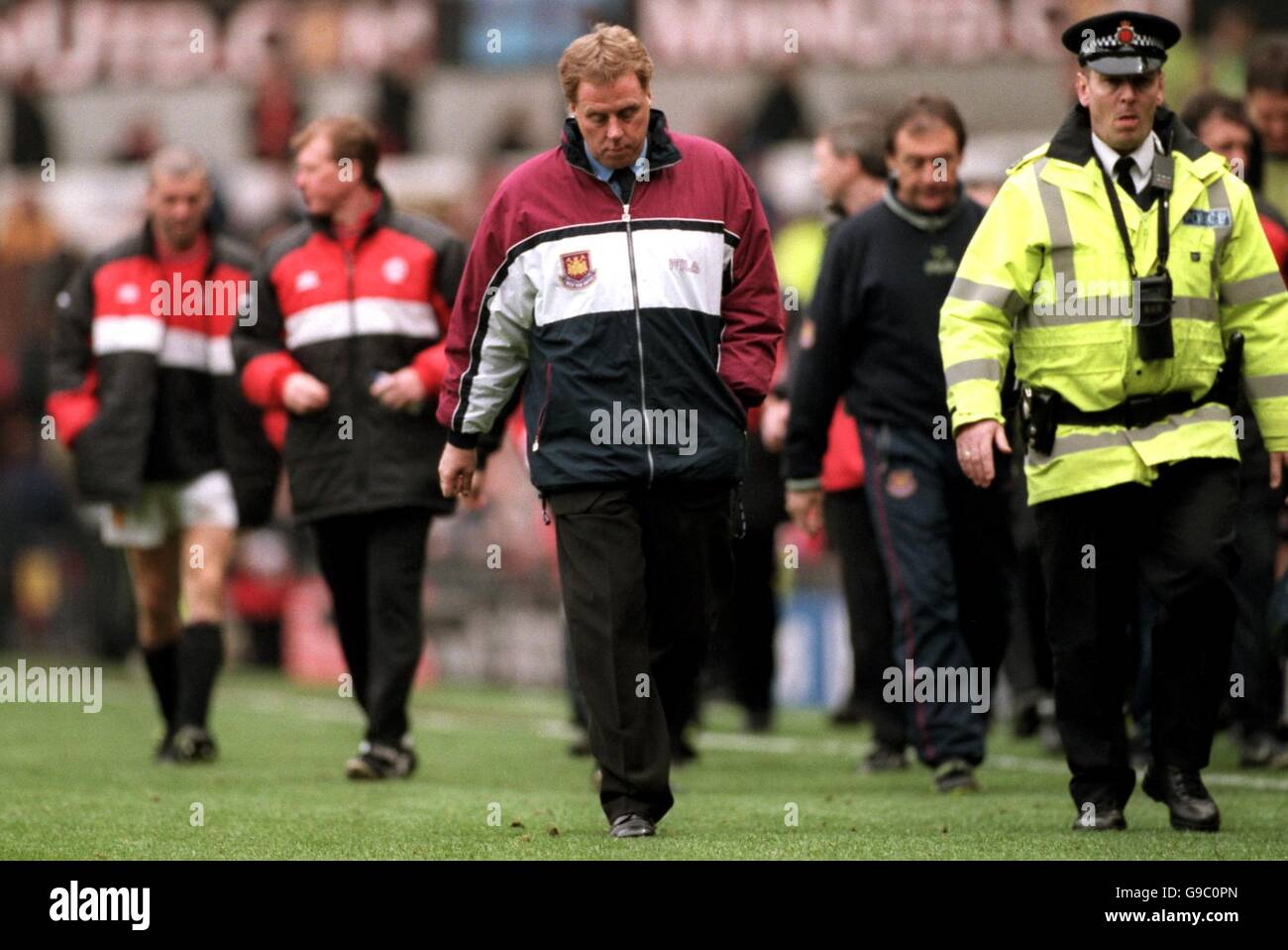 Soccer - FA Carling Premiership - Manchester United v West Ham United. West Ham United manager Harry Redknapp trudges off after seeing his side lose 7-1 Stock Photo
