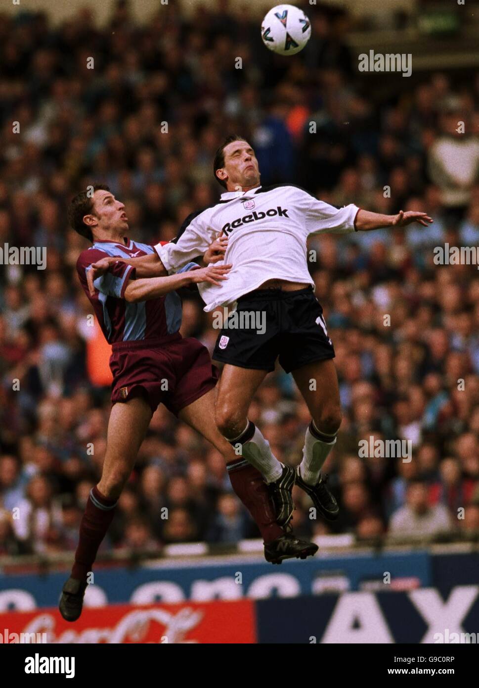 (L-R) Aston Villa's Gareth Southgate is beaten to a header by Bolton Wanderers' Dean Holdsworth Stock Photo