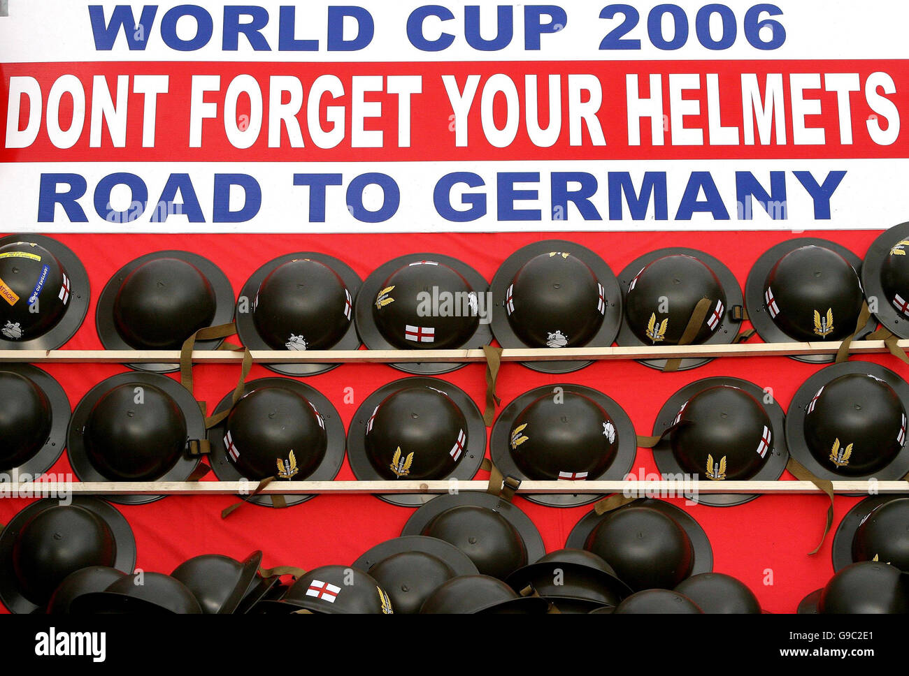 World War II British Tommy Helmets for sale outside the stadium ahead of the friendly international match between England and Hungary at Old Trafford, Manchester. Stock Photo