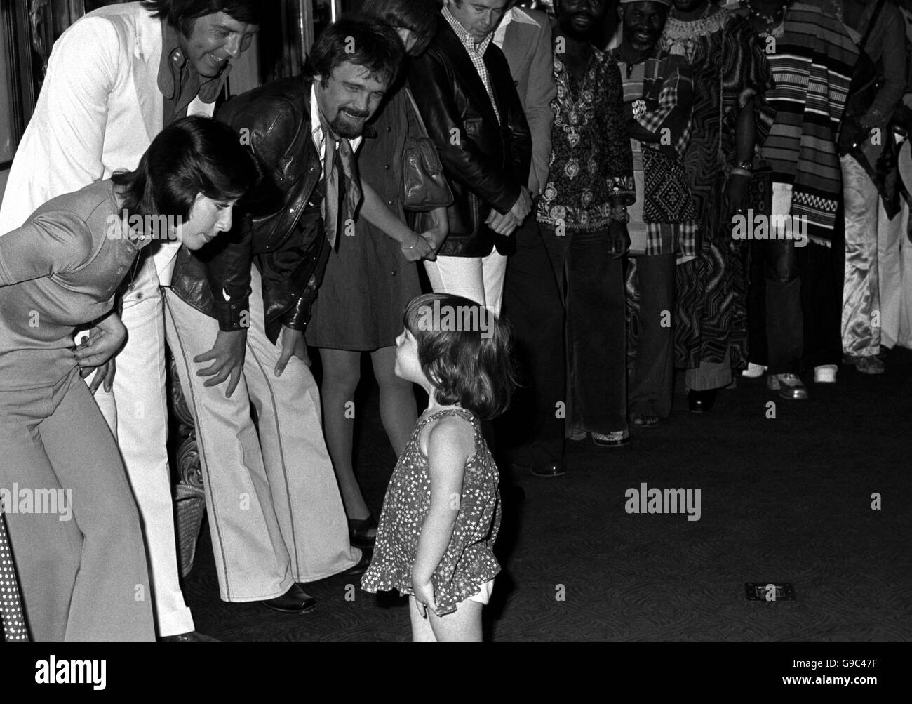Caroline Urquart, who is nearly four, stands in for Princess Anne. being presented to caroline, who attends one of the fund's playgroups are Helen Shapiro, Marty Wilde (white suit) and Duanne Eddy, who star in the show. Caroline will herself meet Princess Anne on the night, when she presents her with a bouquet. Stock Photo