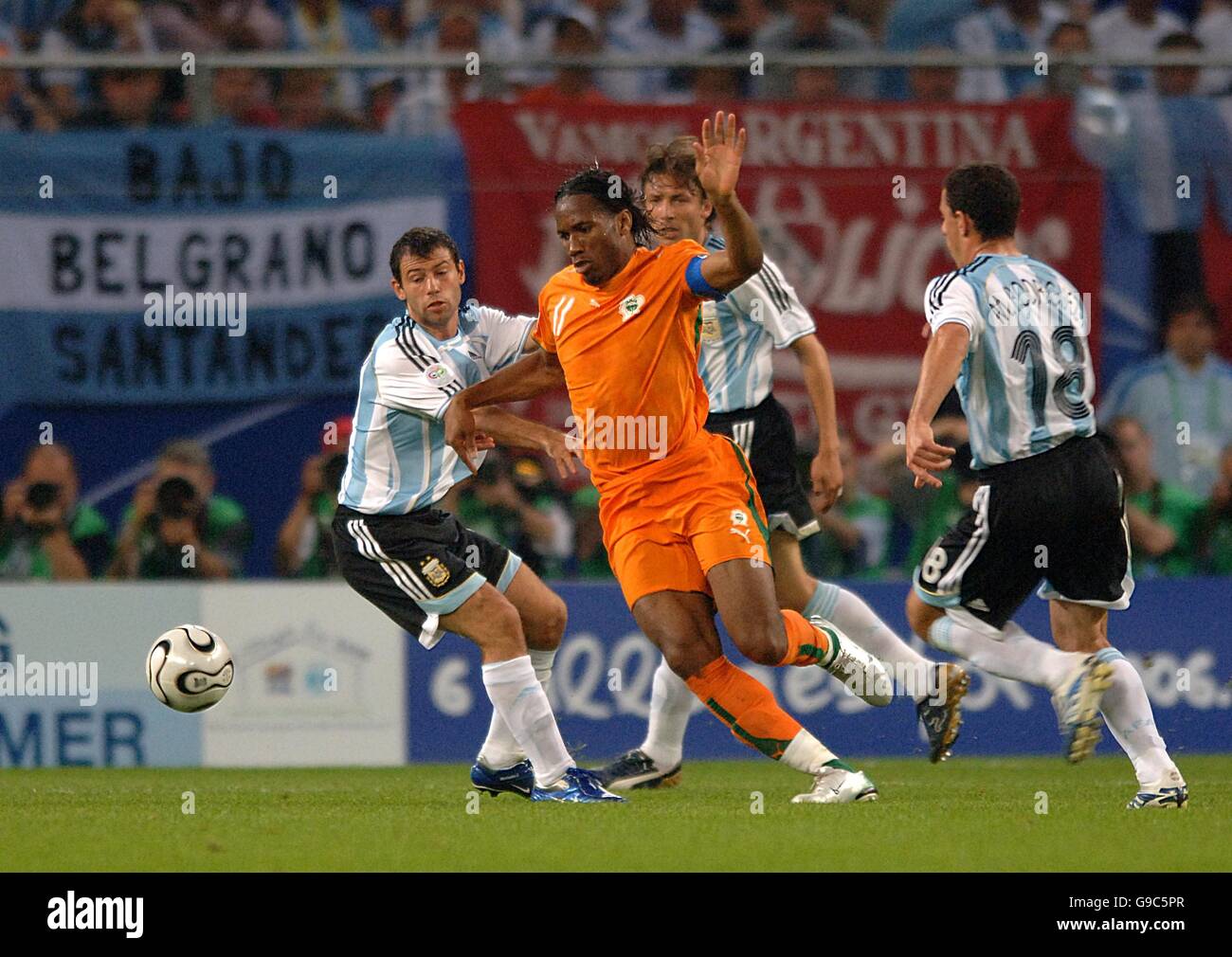 Soccer - 2006 FIFA World Cup Germany - Group C - Argentina v Ivory Coast - AOL Arena. Ivory Coast's Didier Drogba is surrounded by Argentina's Gabriel Heinze, Maxi Rodriguez and Javier Mascherano Stock Photo