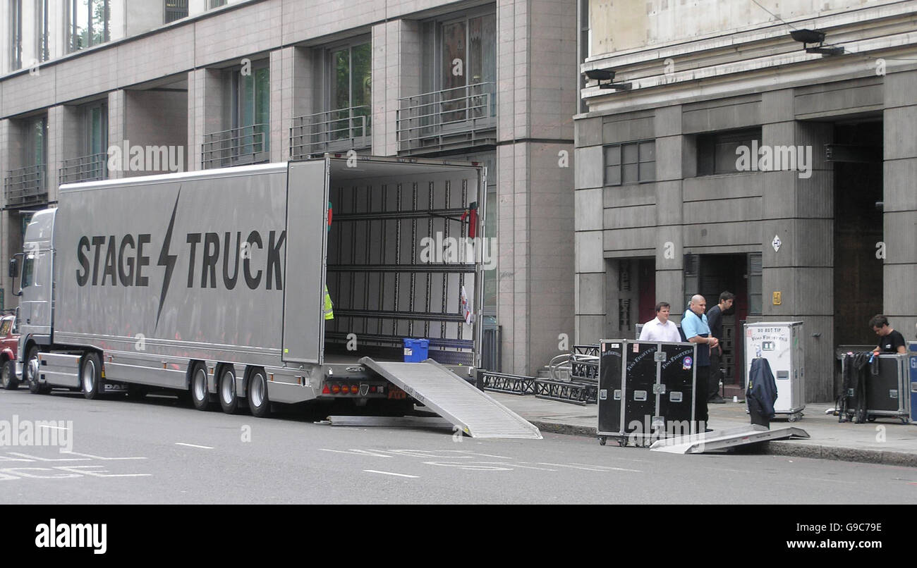 Roadies unload band equipment from a truck for the Foo Fighters' gig at the Apollo Theatre in central London. Stock Photo