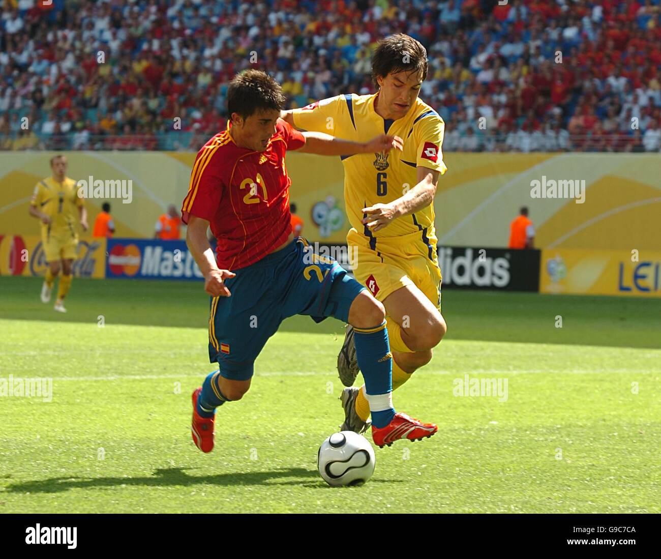 Spain's David Villa shoots under pressure from Ukraine's Andriy Rusol Stock Photo