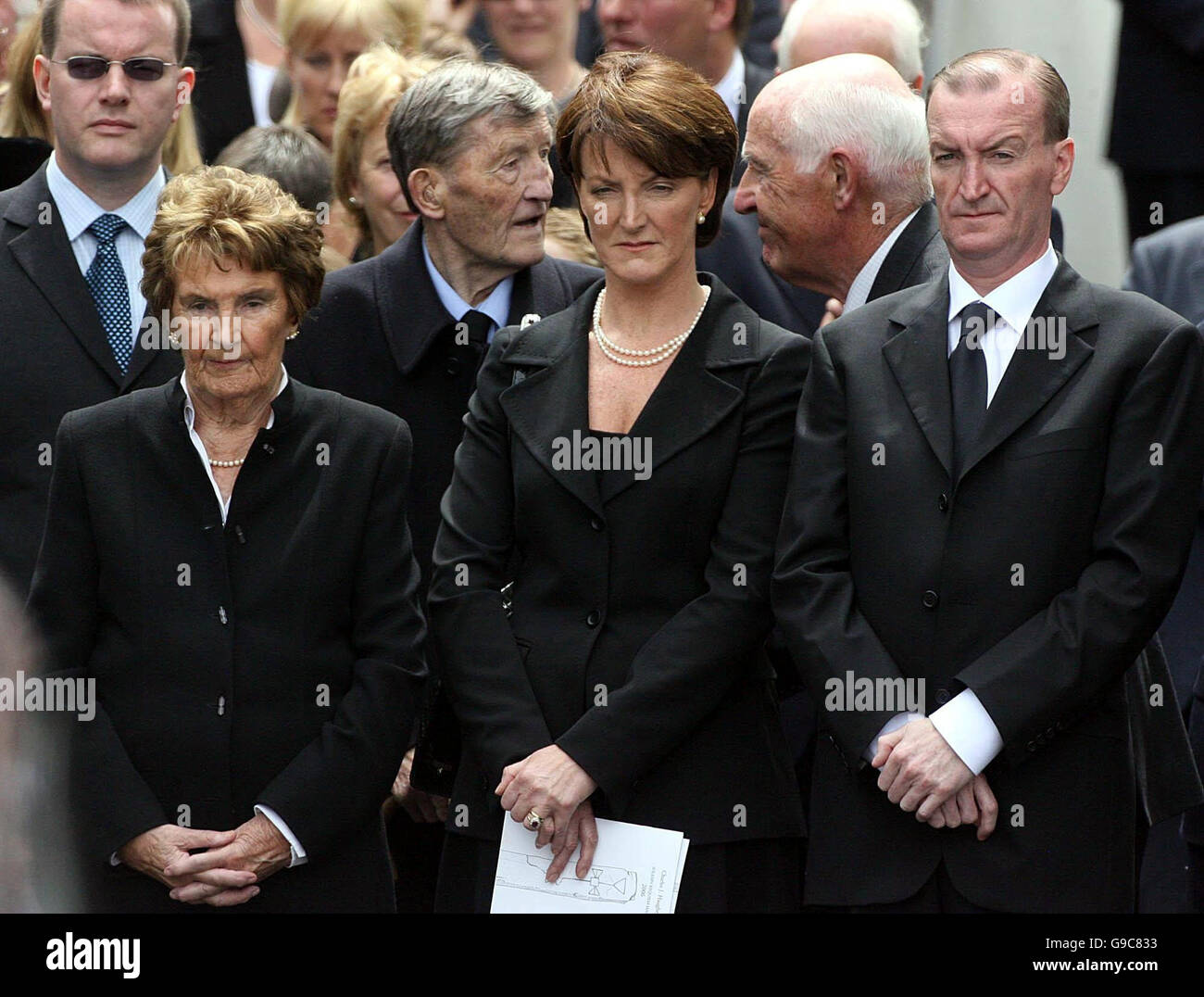 Former Taoiseache Charles Haughey's family watch as his coffin leaves Our Lady of Consolation Church in Donnycarney, Co Dublin. Stock Photo