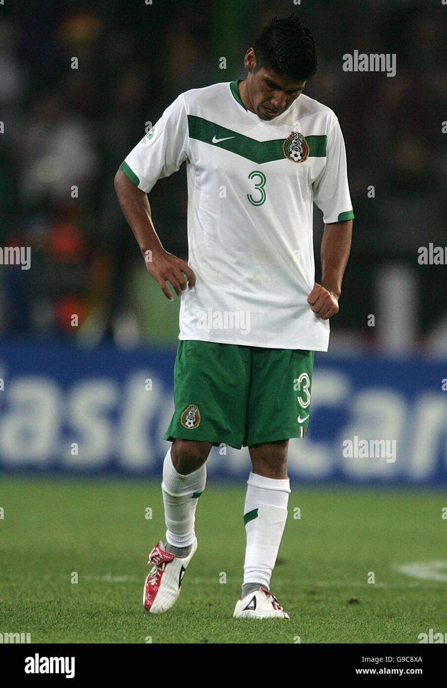 Soccer - 2006 FIFA World Cup Germany - Group D - Mexico v Angola - AWD Arena. Carlos Salcido of Mexico stands dejected after drawing 0-0 with Angola Stock Photo