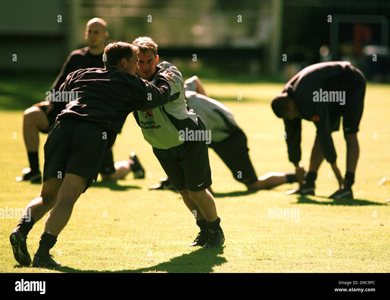 Soccer - Euro 2000 - Holland training. The Dutch De Boer twins, Ronald and Frank, warming up at their training camp in Hoenderloo Stock Photo