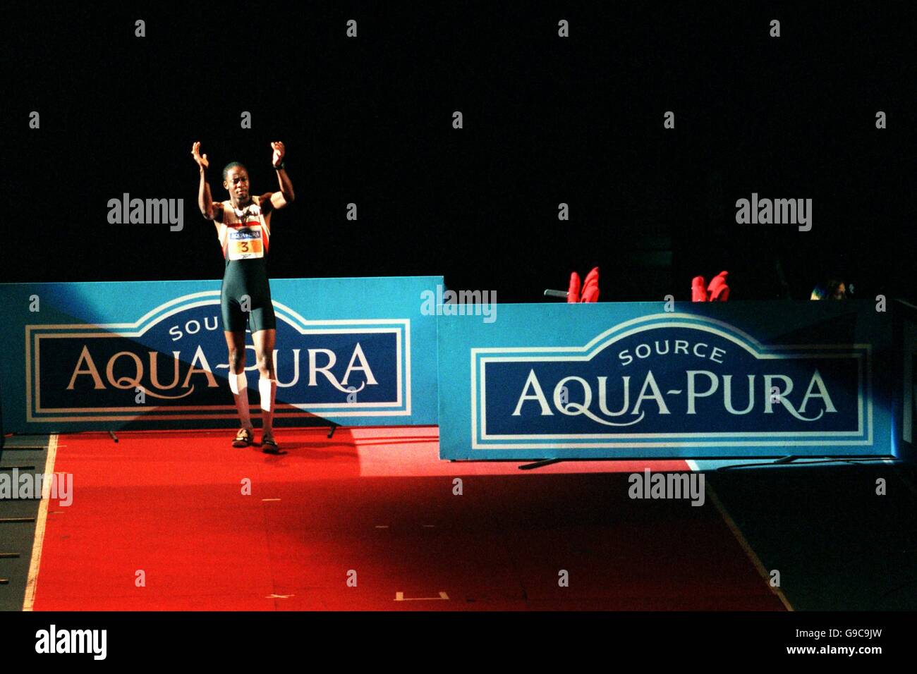 Men's high jump winner, Mark Boswell of Canada, tries to get the crowd going before one of his jumps Stock Photo