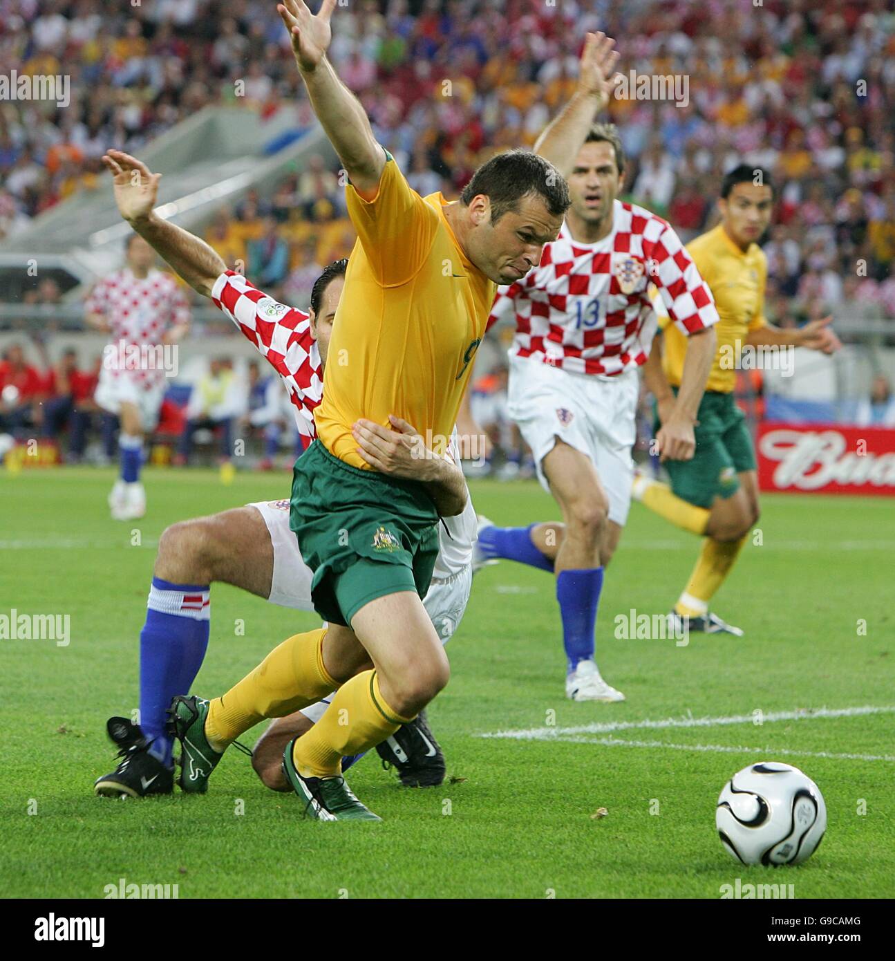 Soccer - 2006 FIFA World Cup Germany - Group F - Croatia v Australia - Gottlieb-Daimler-Stadion. Mark Viduka, Australia is challenged by Josip Simunic of Croatia Stock Photo