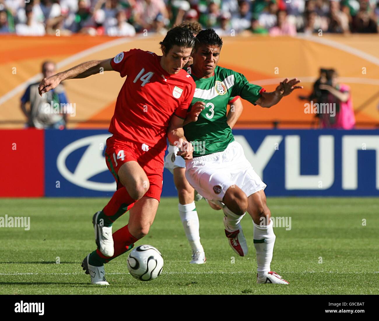 Soccer - 2006 FIFA World Cup Germany - Group D - Mexico v Iran - Franken-Stadion. Irans' Andranik Teymourian and Mexico's Carlos Salcido Stock Photo