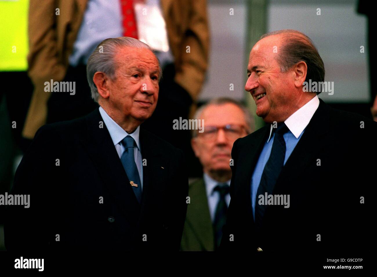 Soccer - Euro 2000 - Group B - Belgium v Sweden. Juan Antonio Samaranch (l) talks to his successor Sepp Blatter (r) Stock Photo