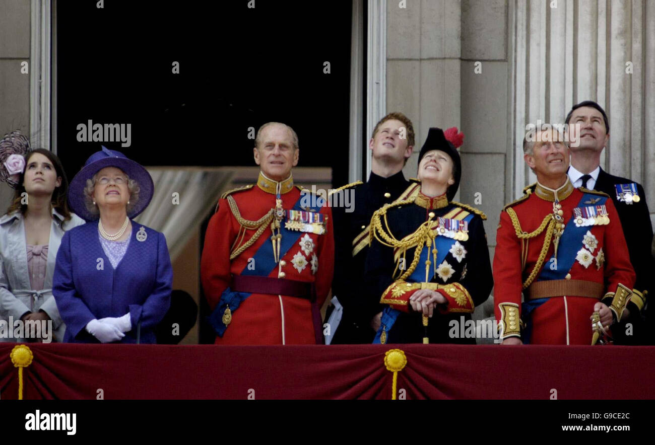 Members of the Royal Family watch a flypast from a Buckingham Palace balcony during the Trooping the Colour ceremony (left to right): Princess Eugenie, Queen Elizabeth II, the Duke of Edinburgh, Prince Harry, the Princess Royal, the Prince of Wales and Rear Admiral Timothy Lawrence. Stock Photo