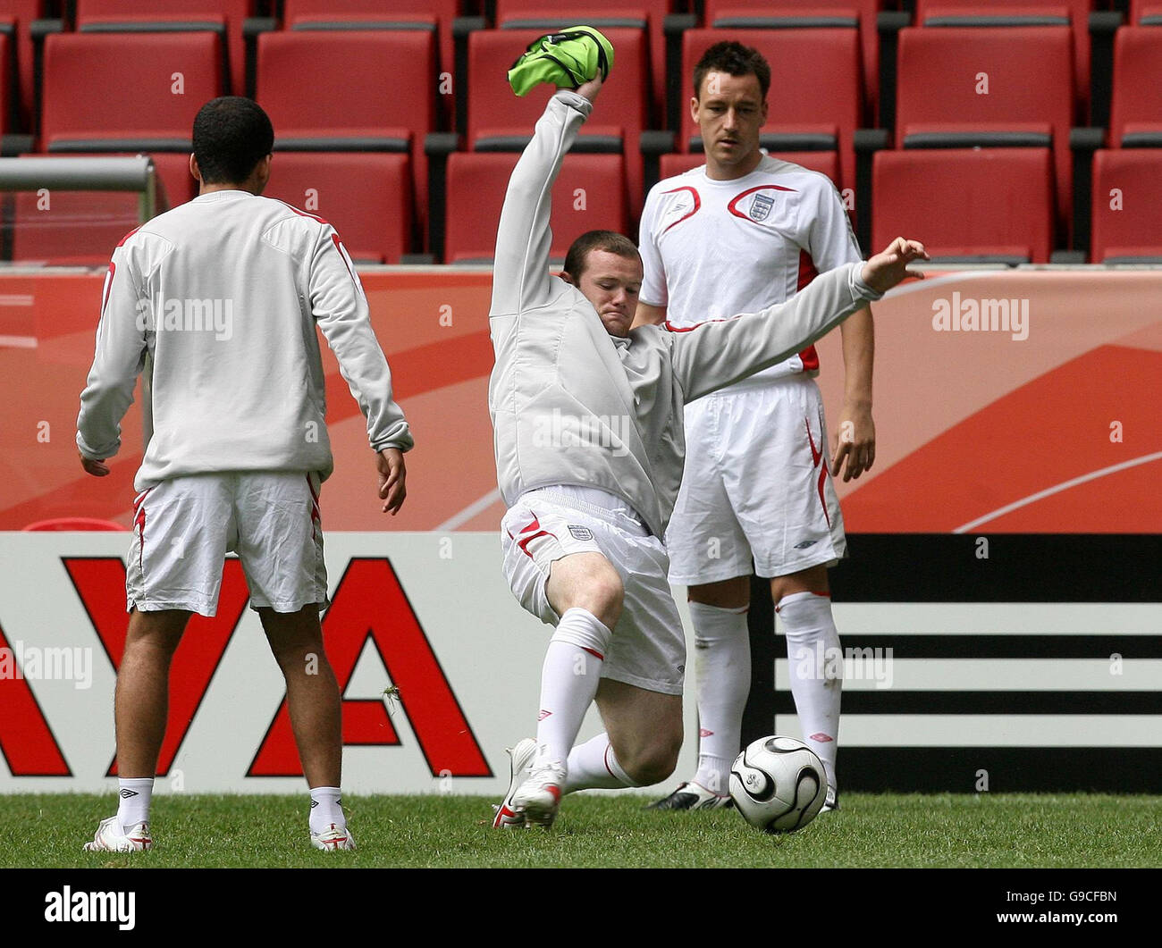 Soccer - 2006 Fifa World Cup - England training session - Cologne. England's Wayne Rooney (centre), John Terry (right) and Theo Walcott during a training session at FIFA World Cup Stadium, Cologne, Germany. Stock Photo