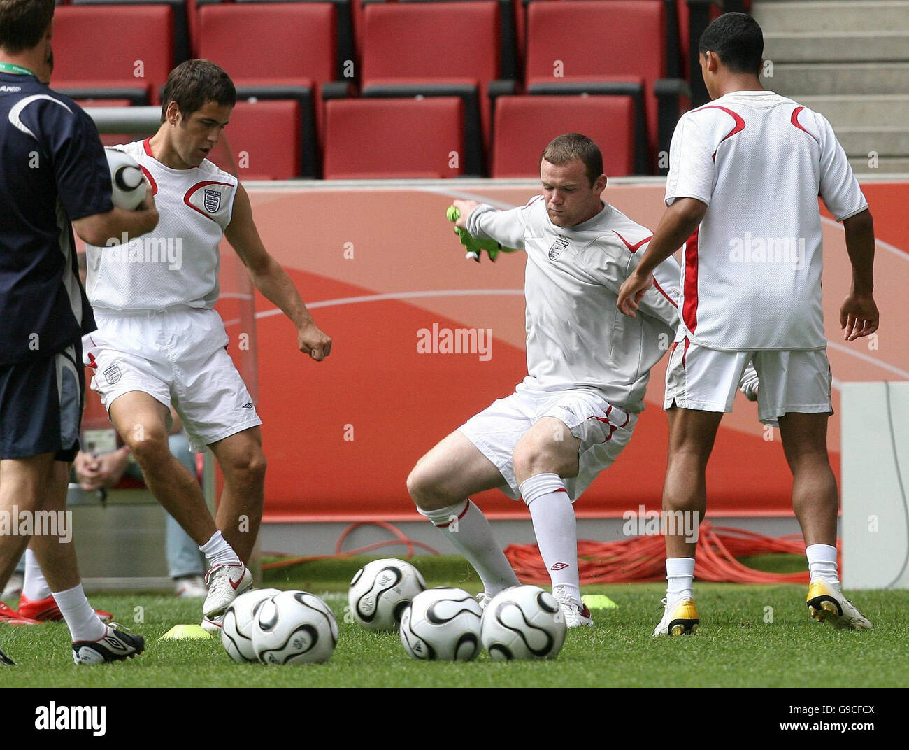 England's Joe Cole (left) Wayne Rooney (centre) and Theo Walcott during a training session at FIFA World Cup Stadium, Cologne, Germany. Stock Photo