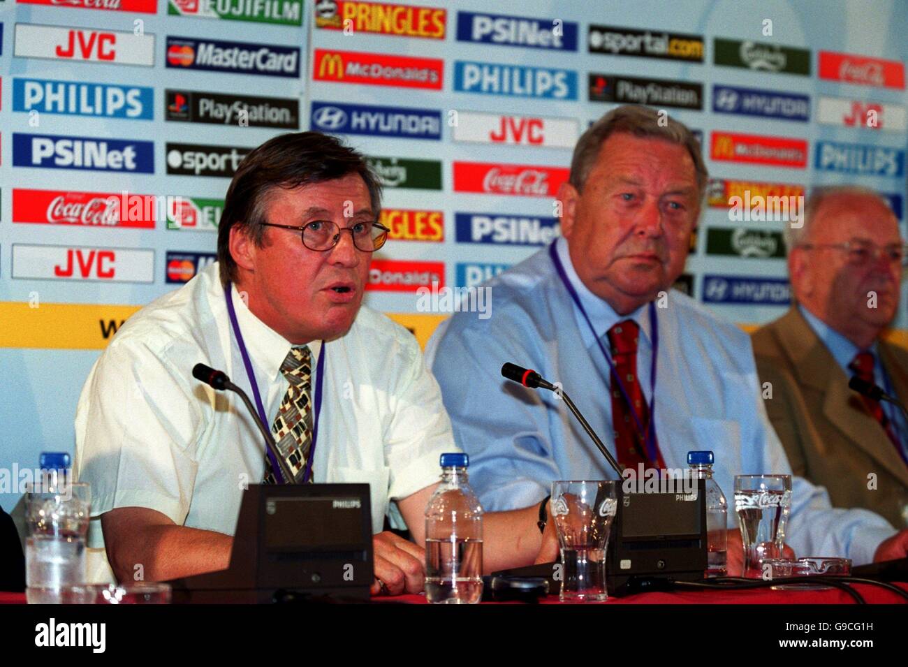 UEFA's Chief Executive Gerhard Aigner (L) and the President of UEFA Lennart Johansson (R) discuss their stance on the English football hooligans at a press conference at Liege this evening Stock Photo
