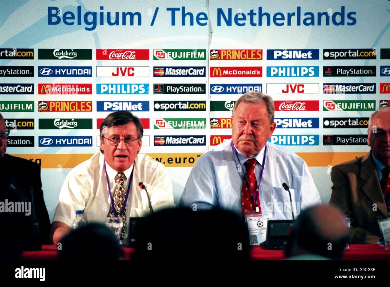 UEFA's Chief Executive Gerhard Aigner (L) and UEFA President Lennart Johansson (R) discuss their stance on the English football hooligans at a press conference at Liege this evening Stock Photo