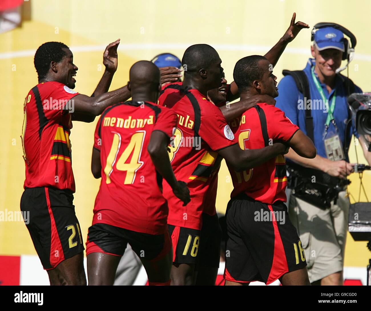 Angola's Amado Flavio (R) celebrates after opening the scoring Stock