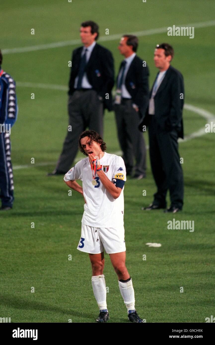 Italy captain Paolo Maldini shows his dejection whilst France collect the trophy Stock Photo