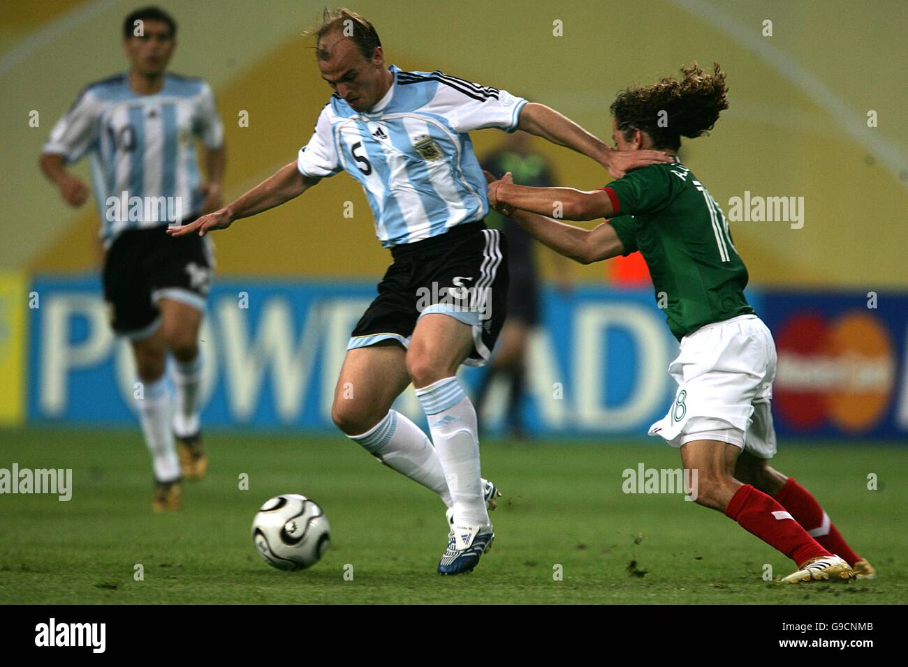 Esteban Cambiasso, Argentina and Andres Guardado, Mexico battle for the ball. Stock Photo