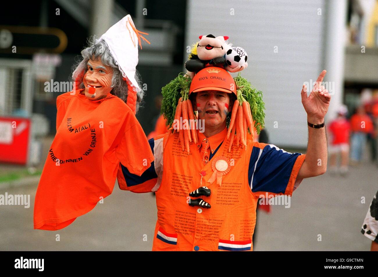 Soccer - Euro 2000 - Group D - Holland v Czech Republic. A Holland fan makes his way to the Amsterdam Arena with his friend Stock Photo