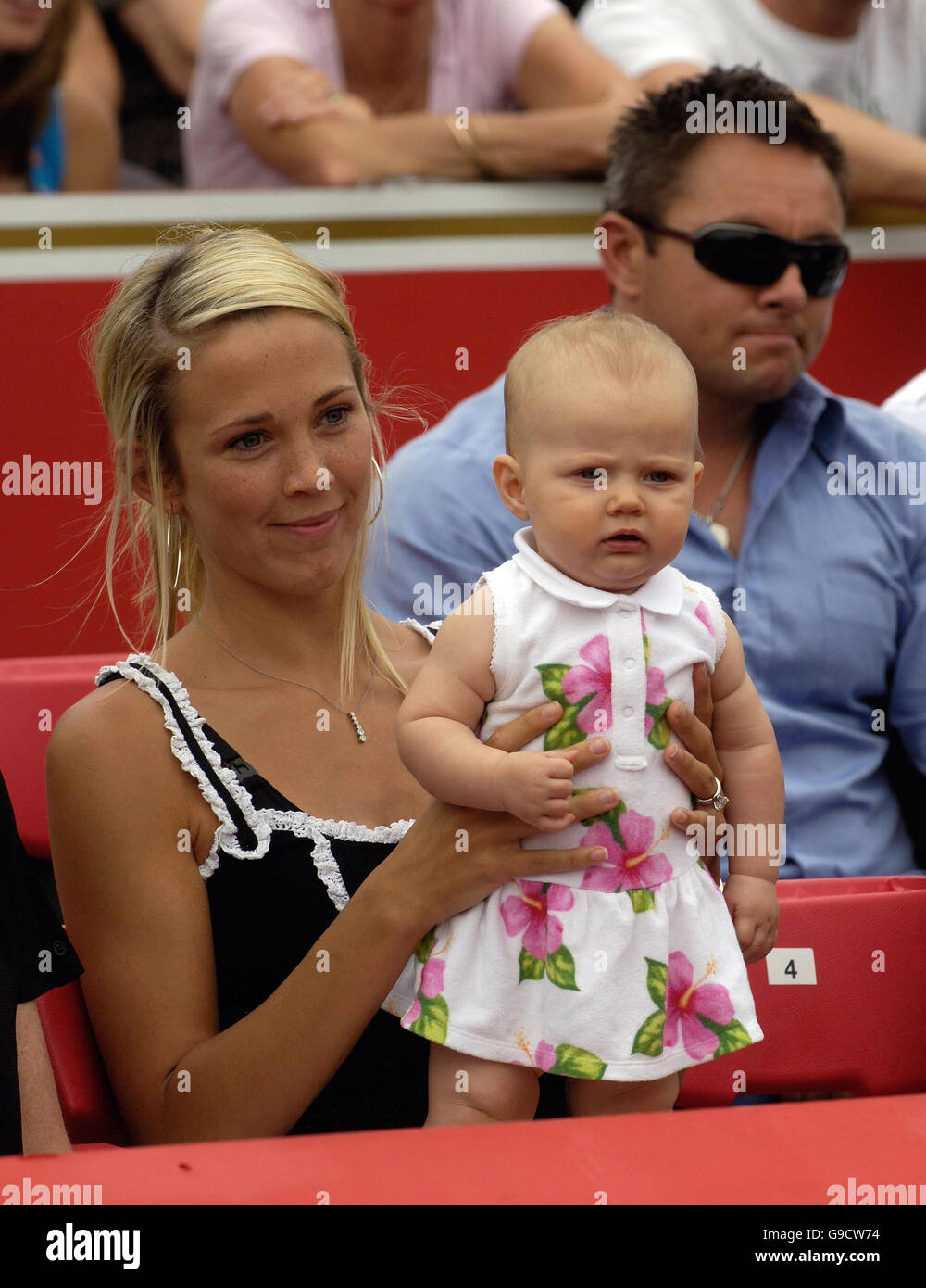 Lleyton Hewitt's wife Bec Cartwright and daughter Mia watches the presentation after he defeated USA's James Blake in The Stella Artois Championships final at The Queen's Club, London. Stock Photo