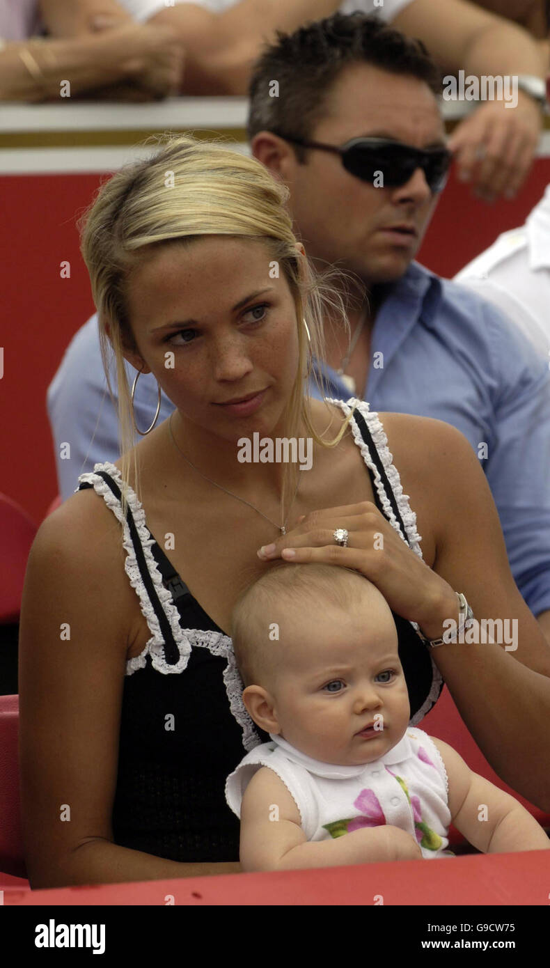 Lleyton Hewitt's wife Bec Cartwright and daughter Mia watch the trophy presentation after he defeated USA's James Blake in The Stella Artois Championships final at The Queen's Club, London. Stock Photo