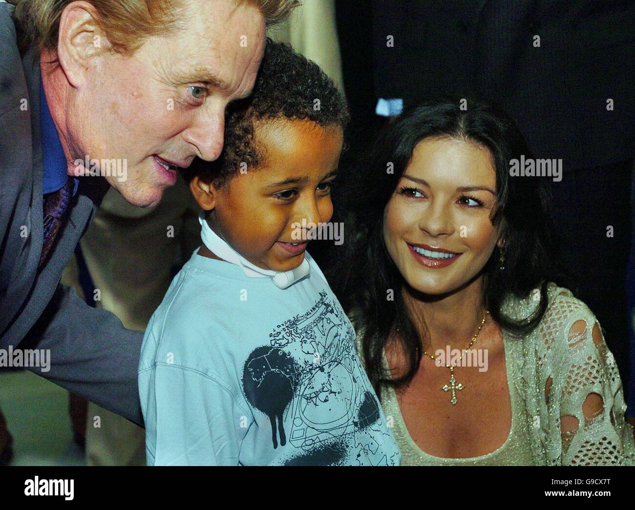 Welsh-born Hollywood actress Catherine Zeta Jones and her husband Michael Douglas meet six year old Taylor Lewis, during their visit to the Children's Hospital at the University Hospital of Wales in Cardiff, Wales. Stock Photo