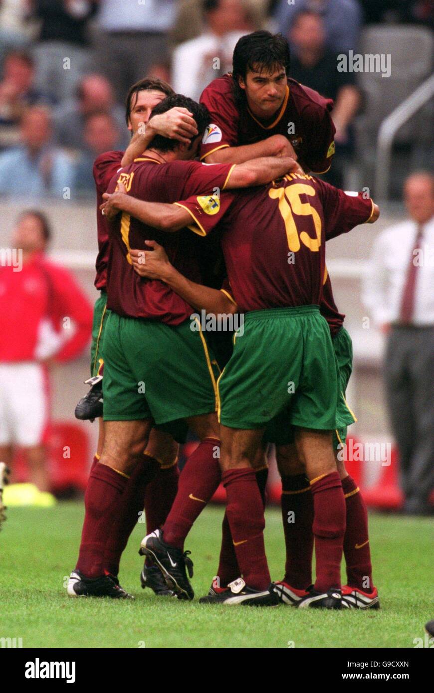 Soccer - Euro 2000 - Quarter Final - Turkey v Portugal. Portugal's goalscorer Nuno Gomes is mobbed by teammates after scoring Stock Photo