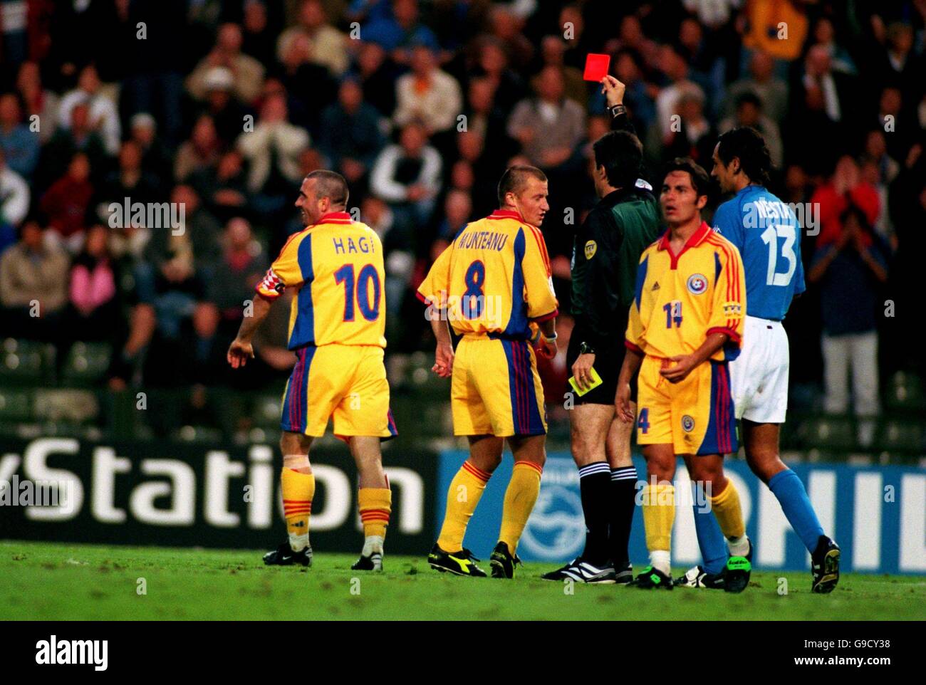 Soccer - Euro 2000 - Quarter Final - Italy v Romania. Romania's Gheorghe Hagi (l) is sent off by referee Vitor Manuel Melo Pereira (c) Stock Photo