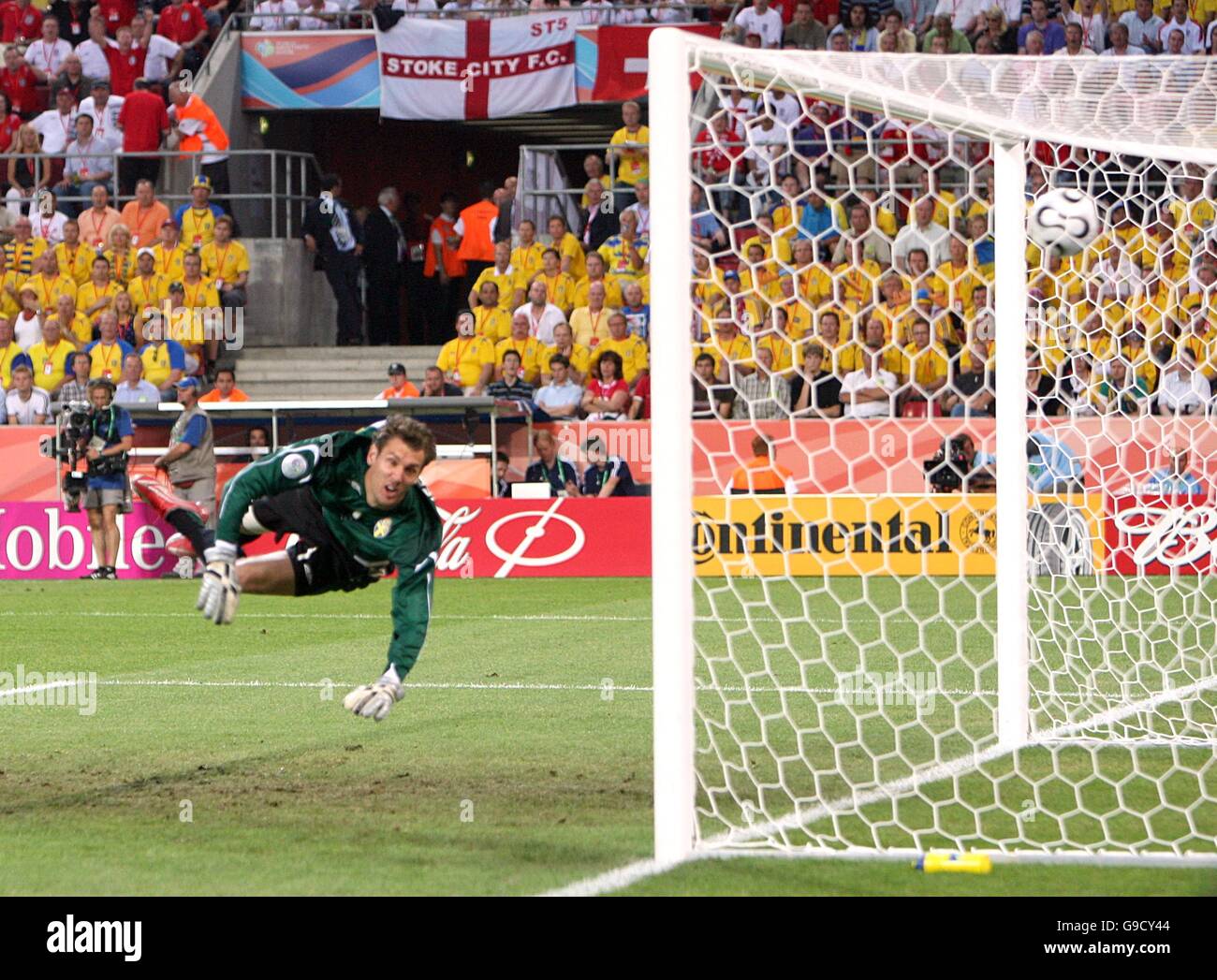 Sweden's goalkeeper Andreas Isaksson looks on as England's Joe Cole's (out of picture) shot goes in the top corner Stock Photo