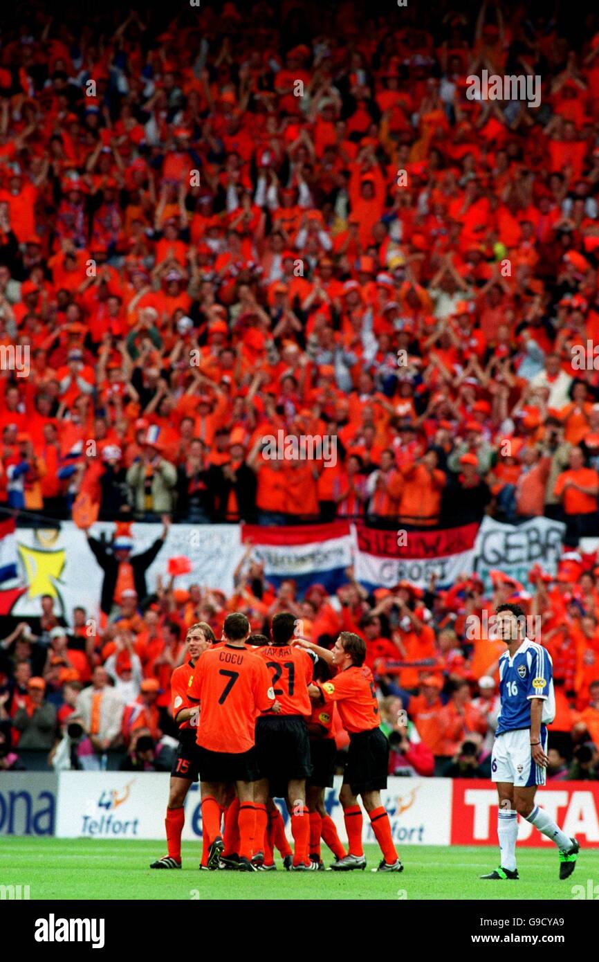 Soccer - Euro 2000 - Quarter Final - Holland v Yugoslavia. Holland's Marc Overmars celebrates his team's fifth goal against a sea of orange Stock Photo