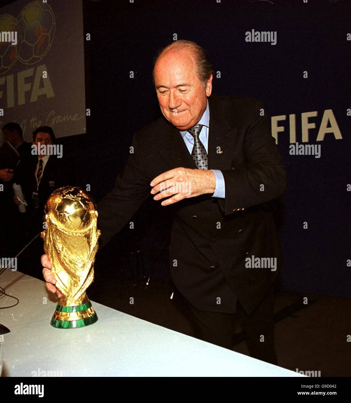 Soccer - FIFA 2006 World Cup - Bidding To Host Tournament. FIFA President Joseph Sepp Blatter with the World Cup Trophy Stock Photo