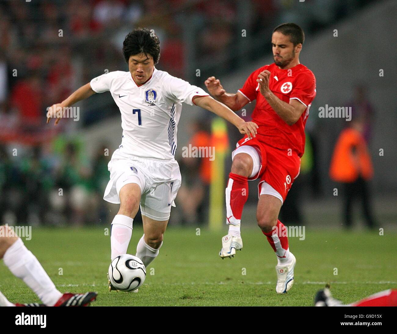 (L-R) South Korea's Ji-Sung Park and Switzerland's Ricardo Cabanas battle for the ball Stock Photo