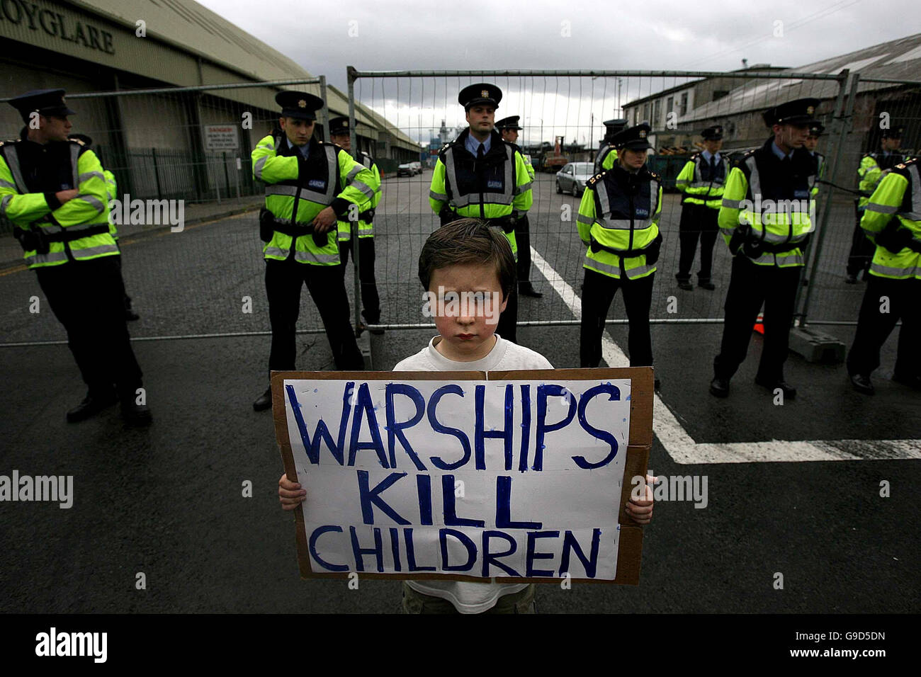 A young boy with the anti-war activists who marched against the visit of British war ship HMS Ocean at Dublin port. Stock Photo