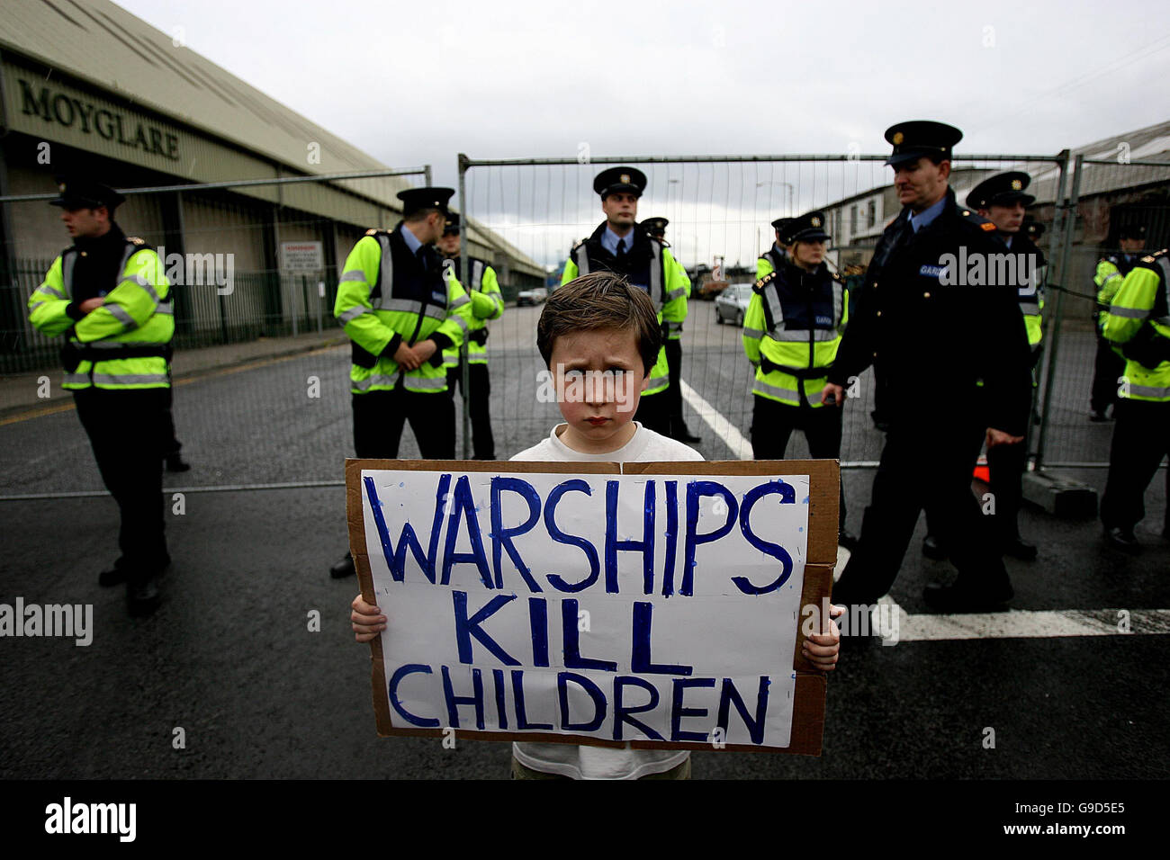 A young boy with the anti-war activists who marched against the visit of British war ship HMS Ocean at Dublin port. Stock Photo