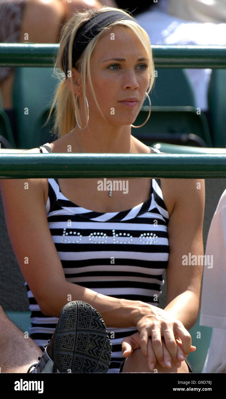 Bec Cartwright, wife of Australia's Lleyton Hewitt watches his fourth round match against Spain's David Ferrer at The All England Lawn Tennis Championships at Wimbledon. Stock Photo