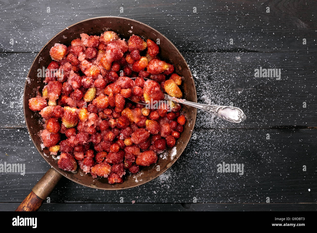 Strawberry Jam preparation. Berries mixed with sugar left for juice release Stock Photo