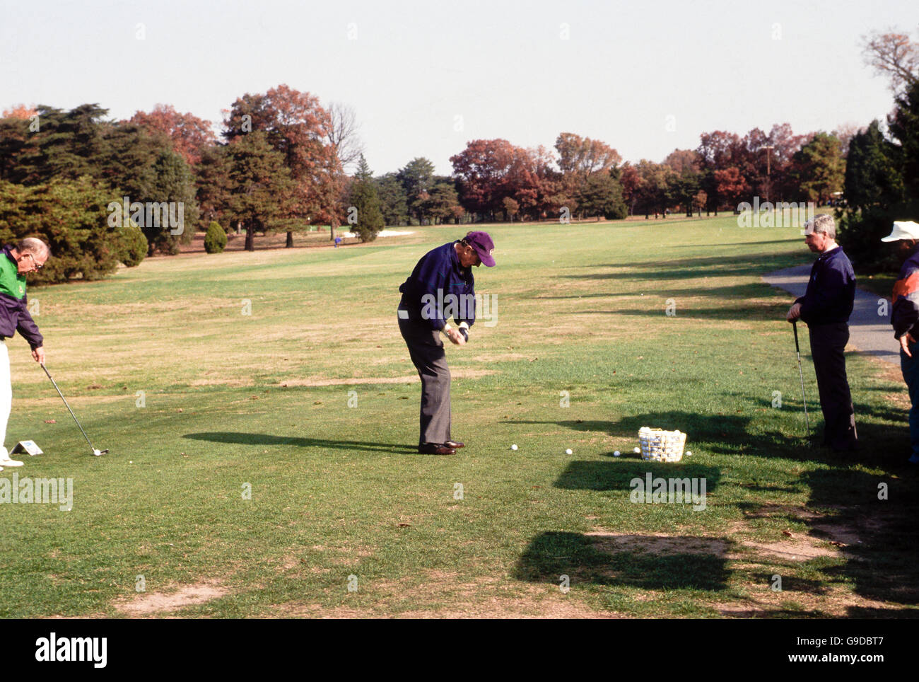 President George H.W. Bush plays golf at Andrews Air Force Base in Maryland  Credit: Mark Reinsteini Stock Photo - Alamy