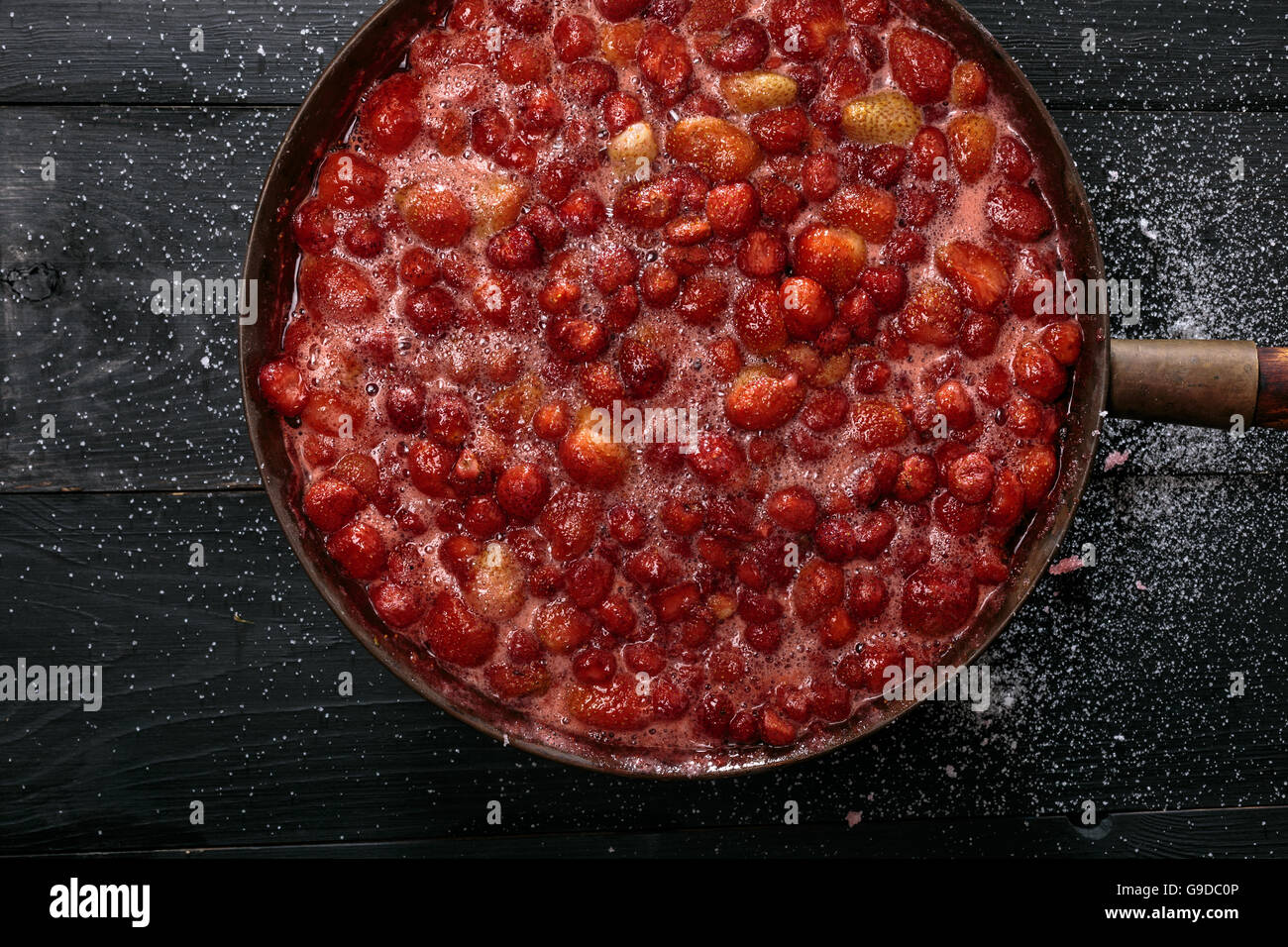 Strawberry Jam preparation. Boiling syrup alone. Selective focus Stock