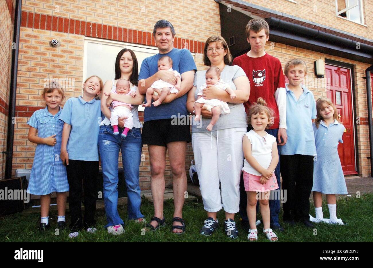 (Left to right) Charlotte Lee aged, 6, Cassandra Bentley, 10, Becky Bentley, 19, Tamsin Bentley, 10 weeks, Robert Bentley, 47, holding Chloe Bentley, 8 weeks, Nichola Bentley, 29, holding Jessika Bentley, 8 weeks, Ross Bentley, 15, Katie Lee, 3, David Bentley, 12, Maddison Bentley, 5. Unemployed Robert Bentley claims his dream of living together as one big happy family in their modest home in Bradley Stoke, Bristol, quickly turned into a nightmare and is blaming the local council for the breakdown of his marriage. Stock Photo