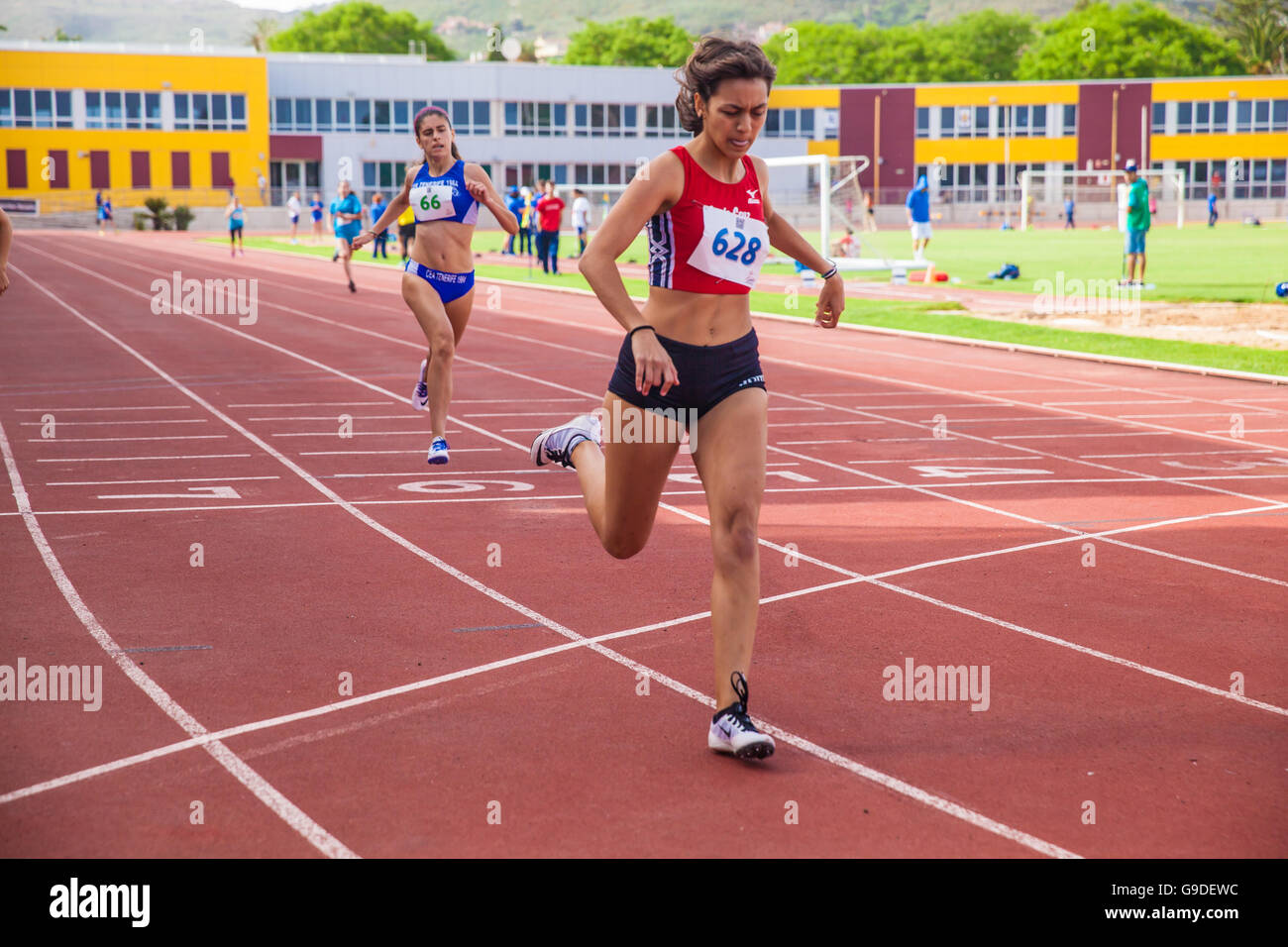 sports girls running on an athletic piste Stock Photo Alamy